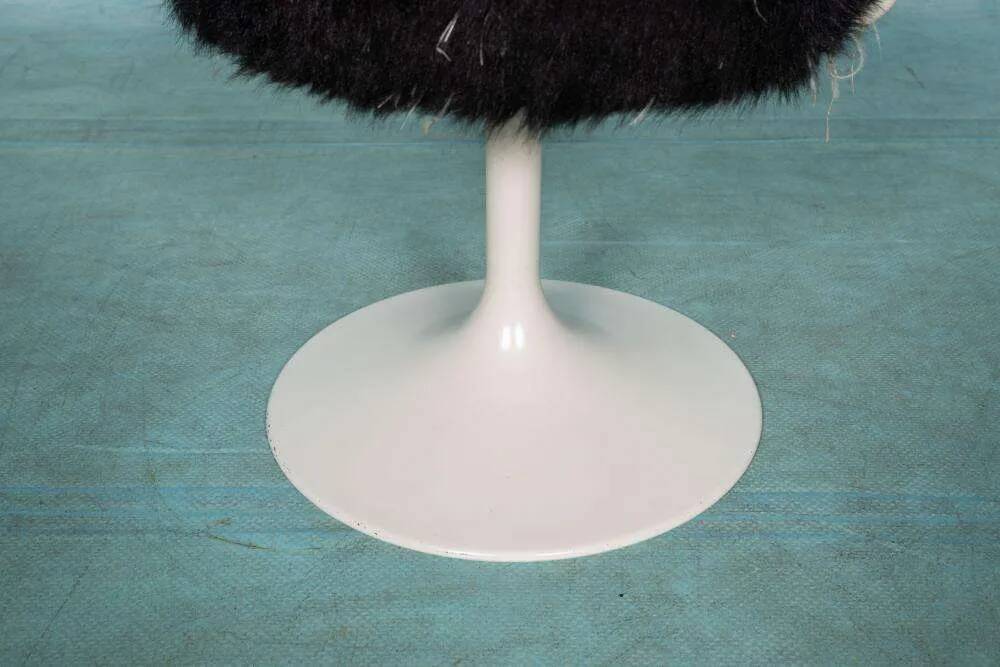 Space age design armchair from the sixties, fluffy stool with trumpet base.