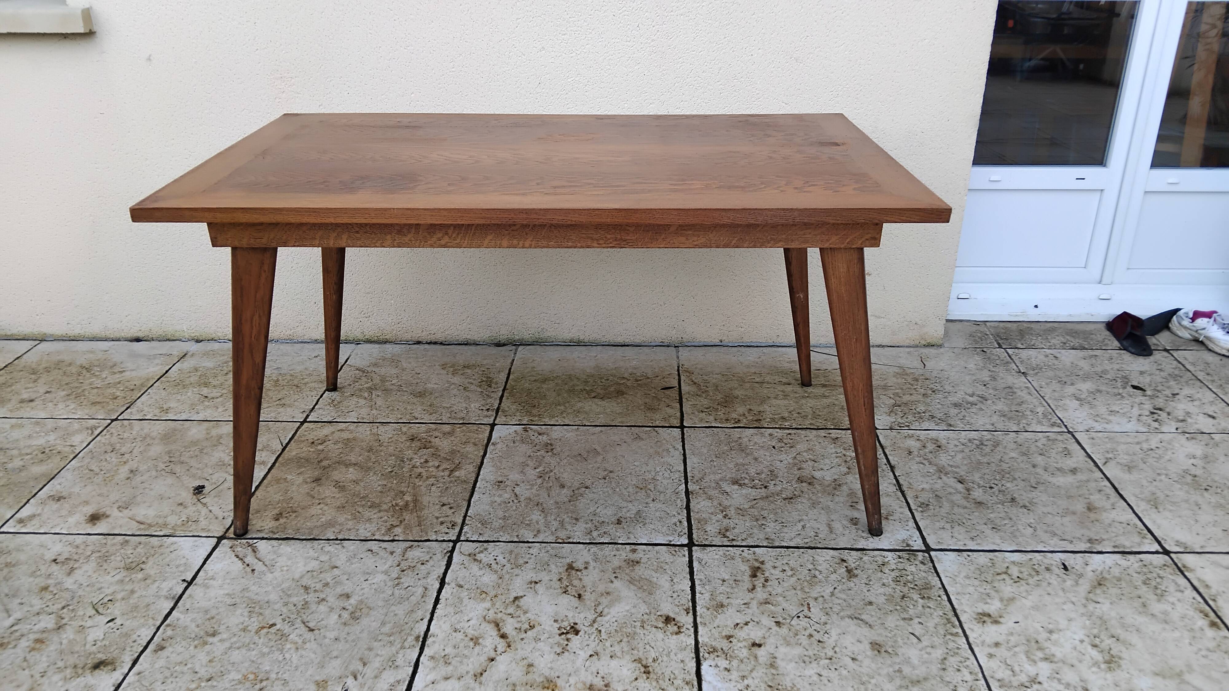 Vintage oak table with tapered legs.