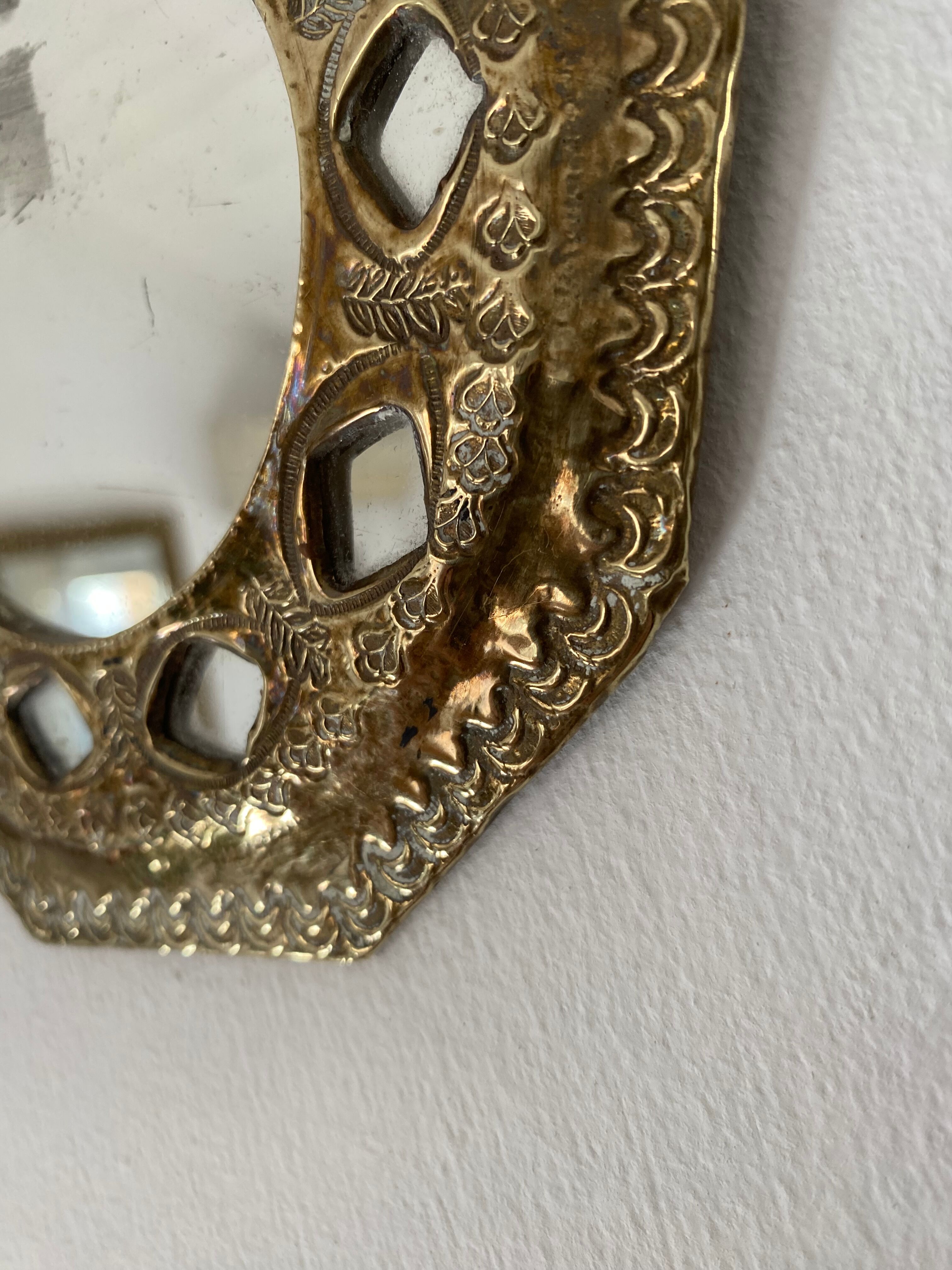 Antique mirror in worked brass