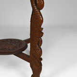 Asian coffee table carved with dragons and peacocks, Indonesia, early 20th century
