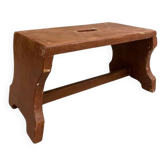 Small stool or Hungarian bench in wine red.
