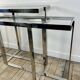 Chrome metal and glass console from the 2000s.
