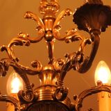 Chandelier in gilded with six arms chiseled bronze.
