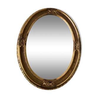 Grand miroir oval en stuc doré vintage