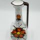 Vintage Italian vase in the shape of a carafe with floral decoration from the 1970s.