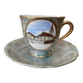 Petite tasse et sa soucoupe en porcelaine décor bleuté doré, médaillon Suchy