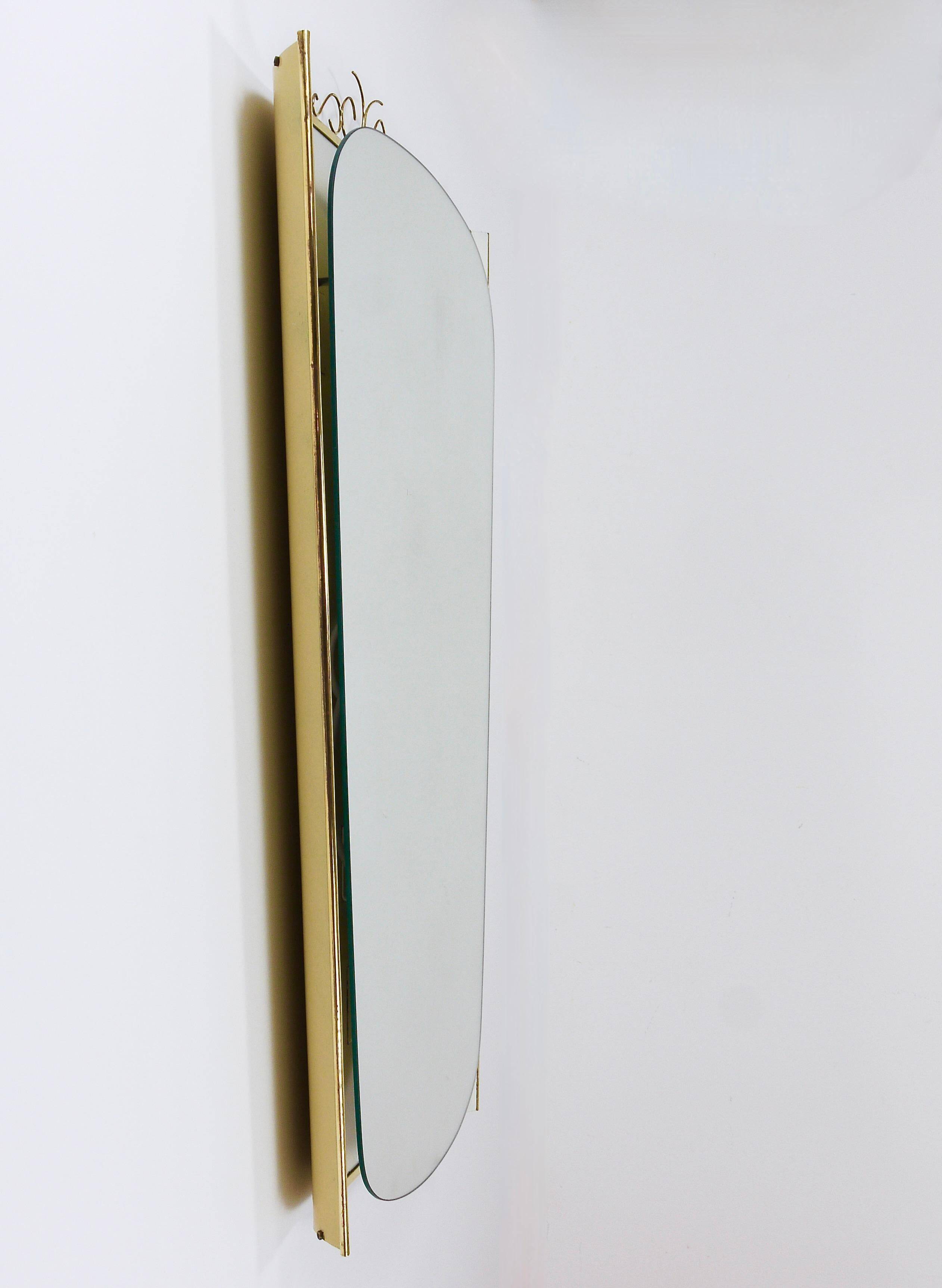 Mid-century illuminated wall mirror by Ernest Igl with brass crown, by Hillebrand.