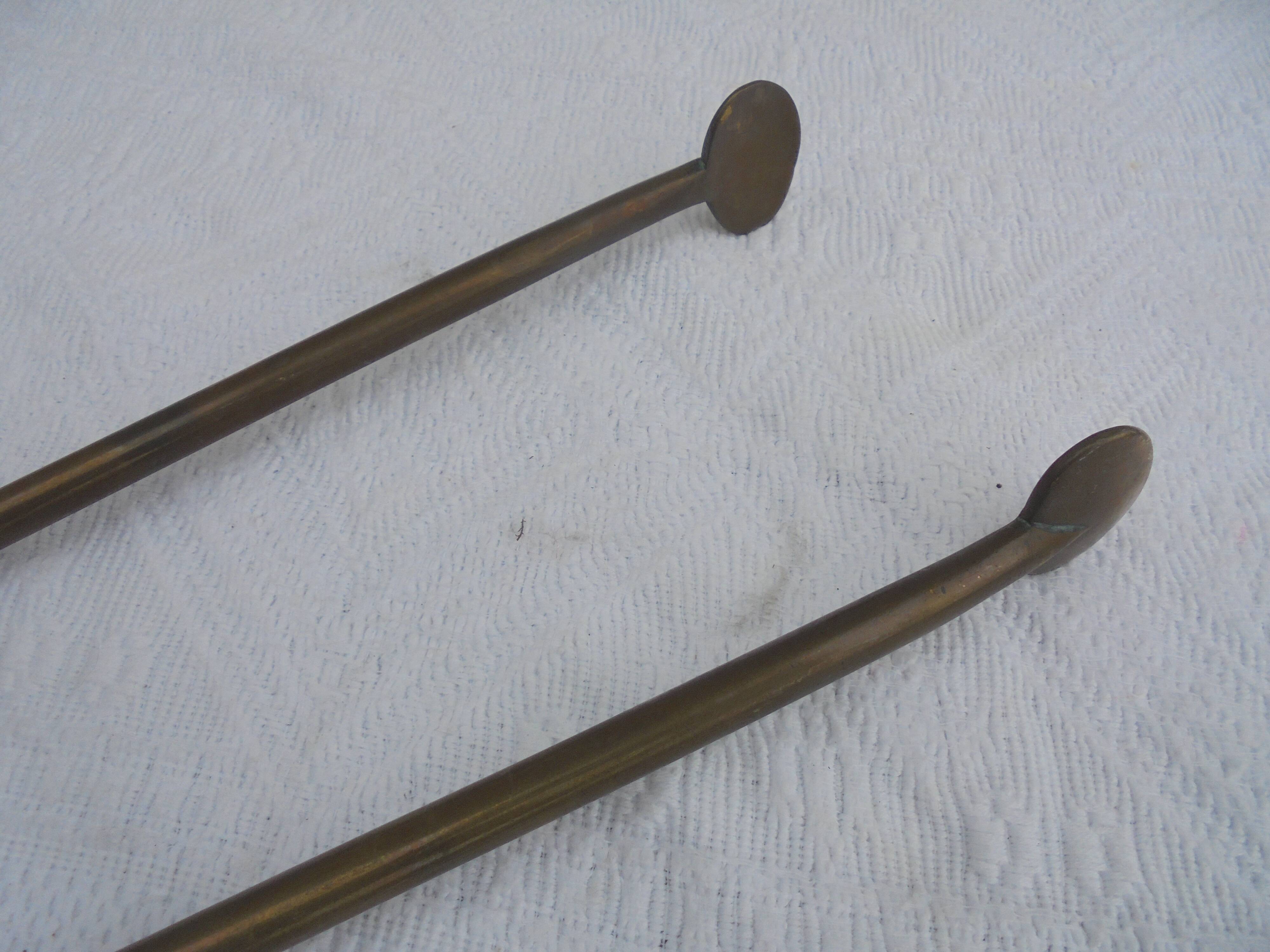 Old brass log clamp for fireplace