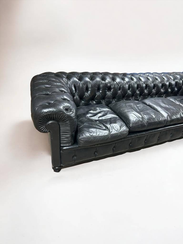 Large and old four-seater leather chesterfield sofa early 20th century l 260 cm