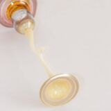 Opalescent and colored glass candlestick in the shape of a flower, Karl Schmid, 1985