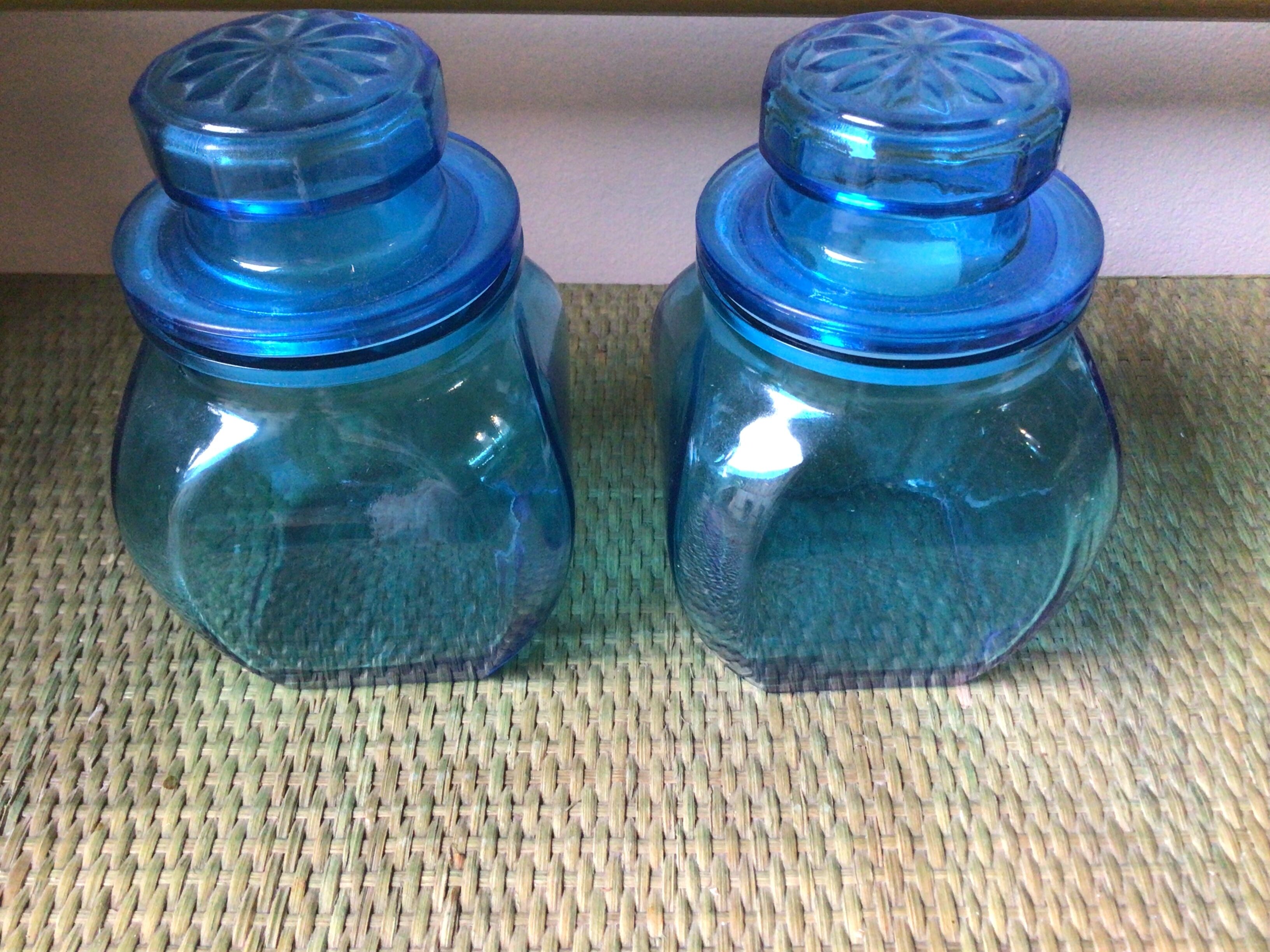 2 blue glass jars