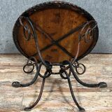Hammered iron coffee table with circular wooden top