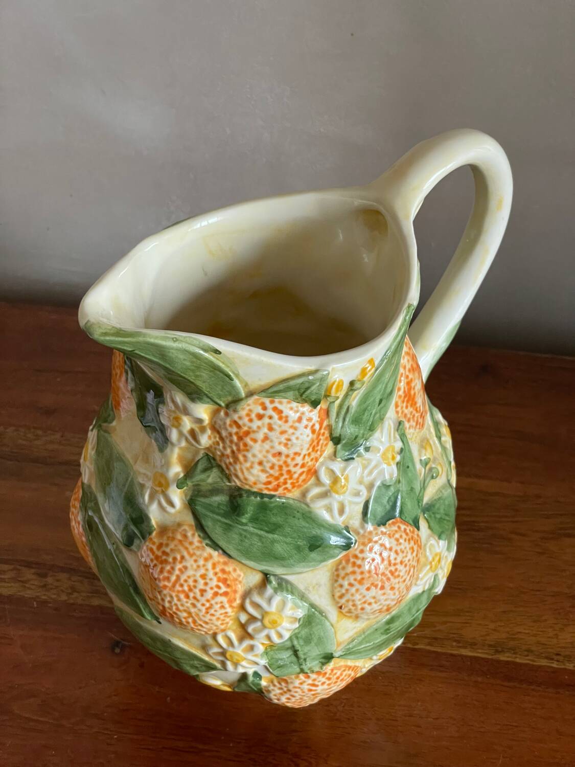 Orange slipware pitcher