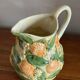 Orange slipware pitcher