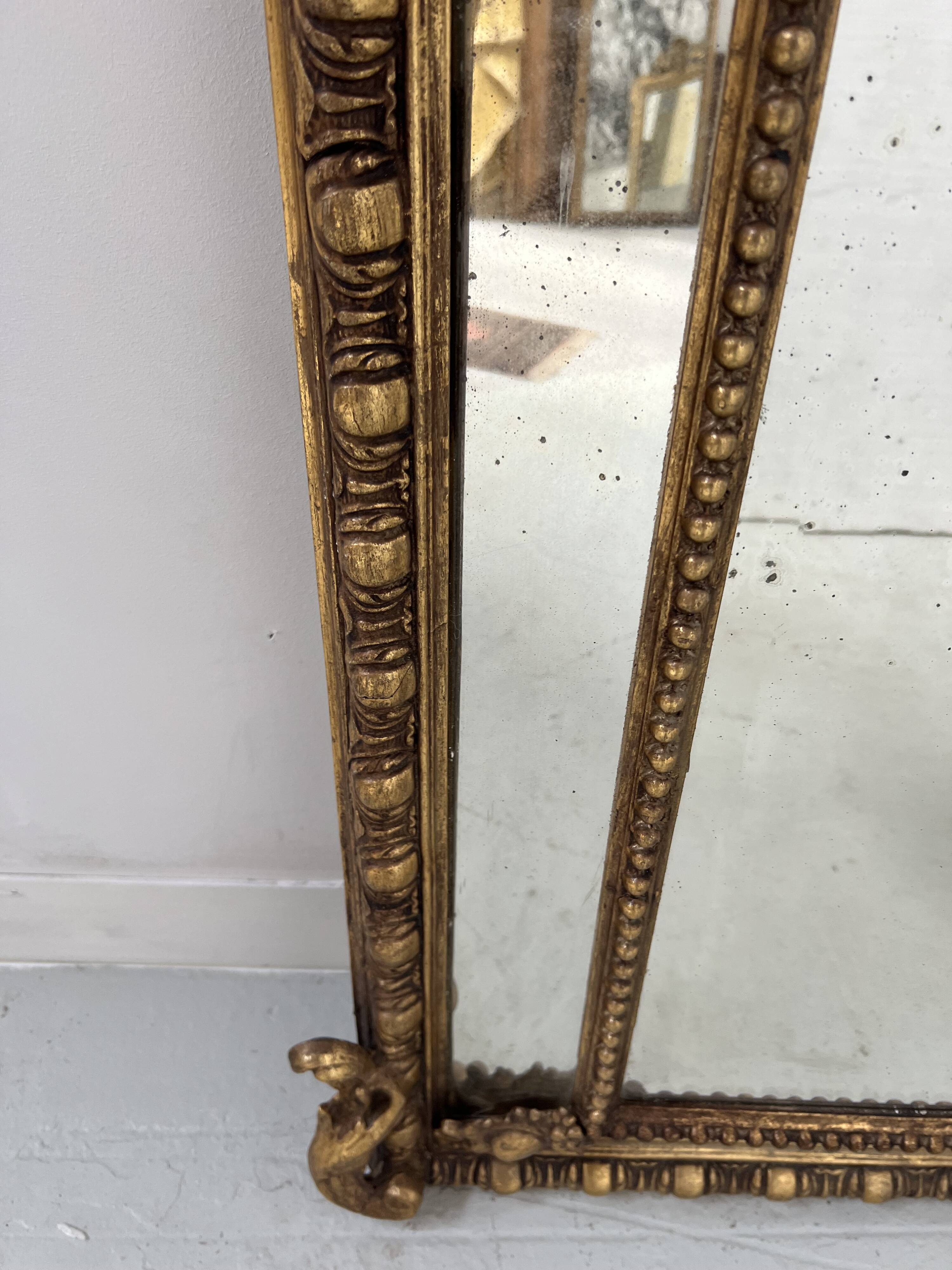 Louis XVI style mirror with parecloses in wood and gilded stucco, 19th century