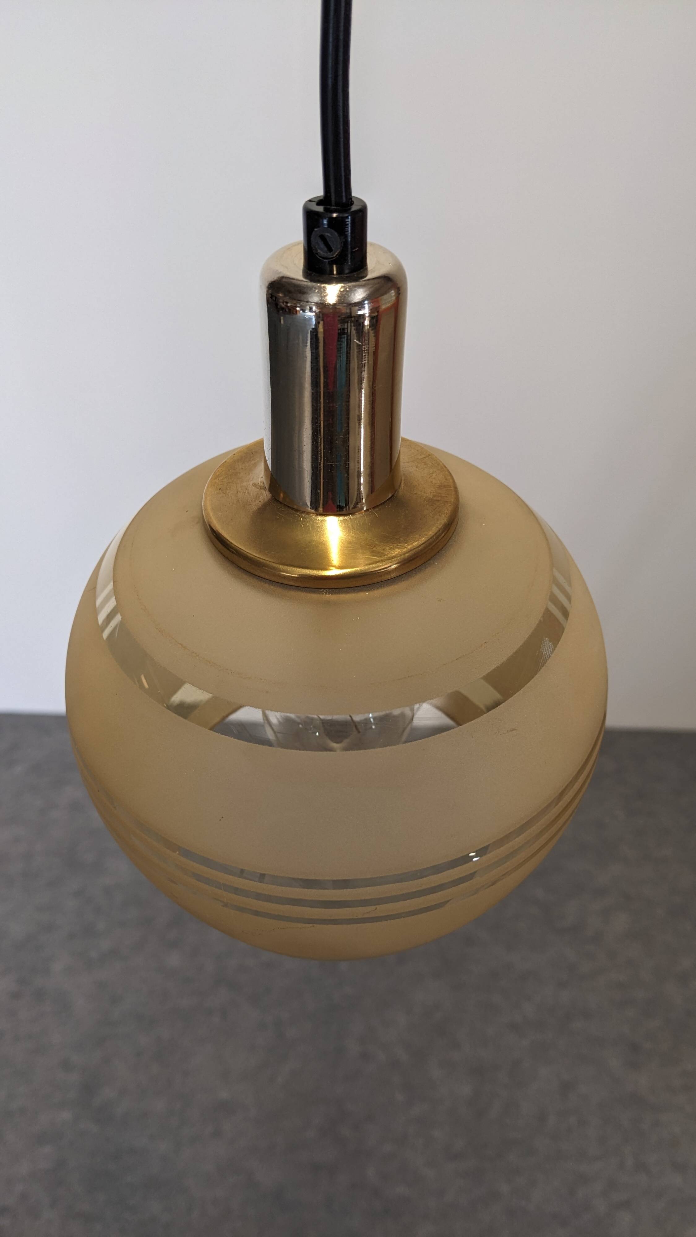 Art Deco style ball pendant light in gold glass