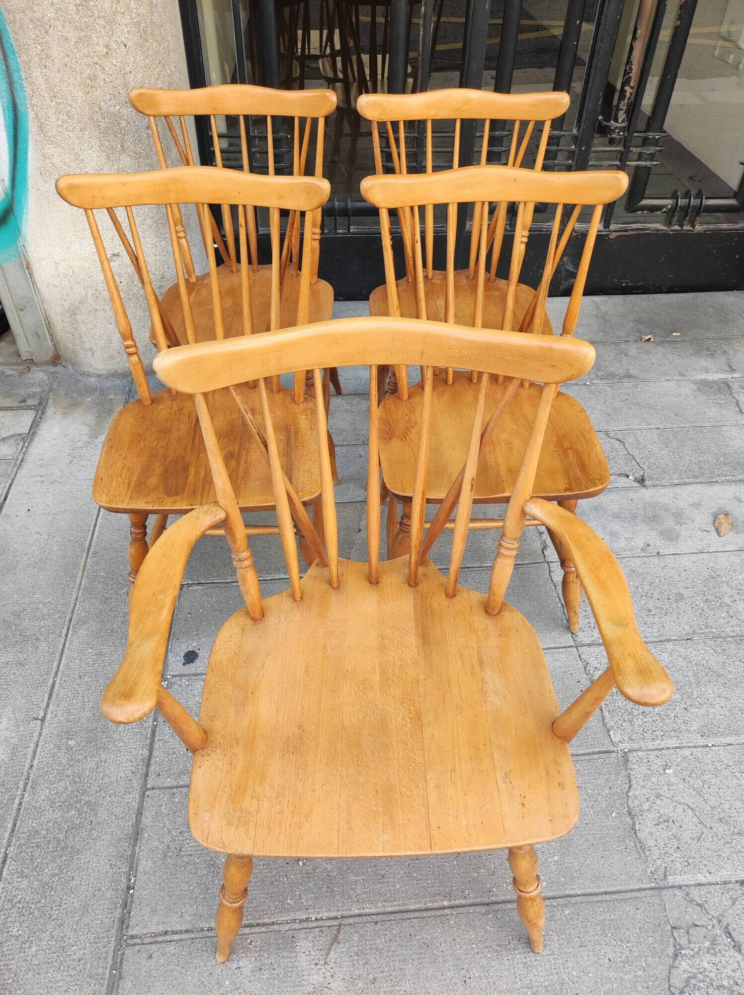 Four chairs and a Heywood Wakefield Windsor armchair. Vintage