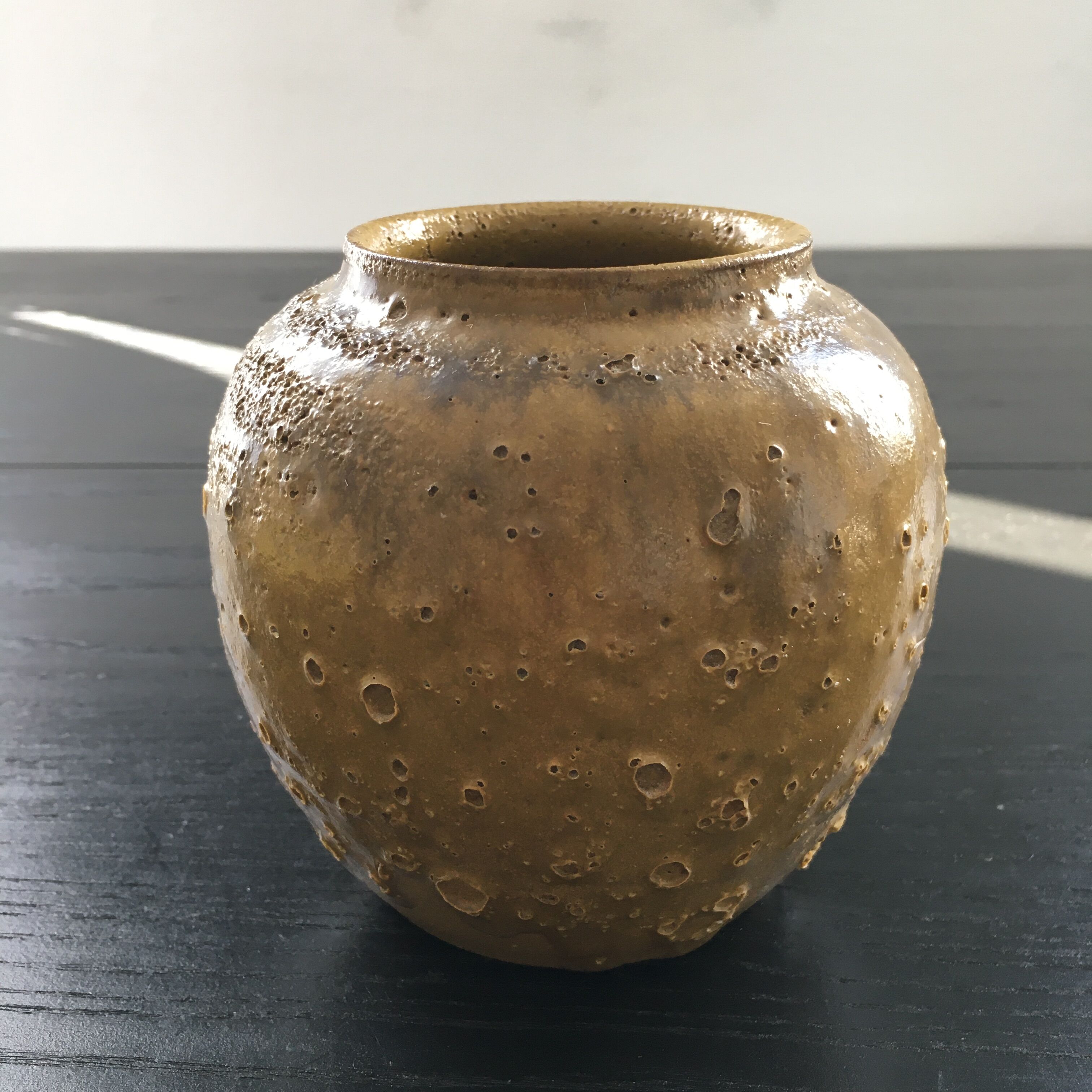 Relief crater ball vase