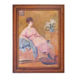 Huile sur toile - non signée - représente une femme assise à côté d'un vase de fleurs.
