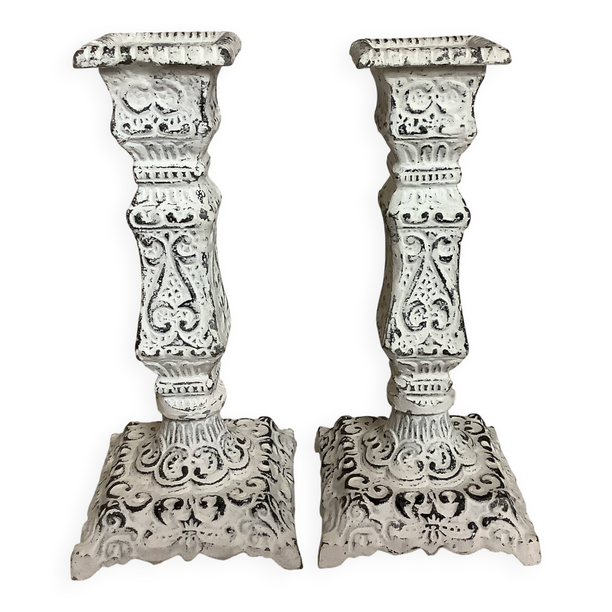 Pair of patinated cast iron candlesticks