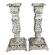 Pair of patinated cast iron candlesticks