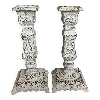 Pair of patinated cast iron candlesticks