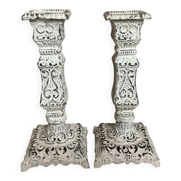 Pair of patinated cast iron candlesticks