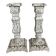 Pair of patinated cast iron candlesticks