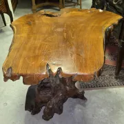 Sculpted olive wood table, made from a root.
