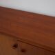 Modern mid-century teak sideboard with brass details.