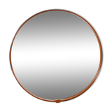 Round mirror covered with leather and chrome, made in France in the 1970s.