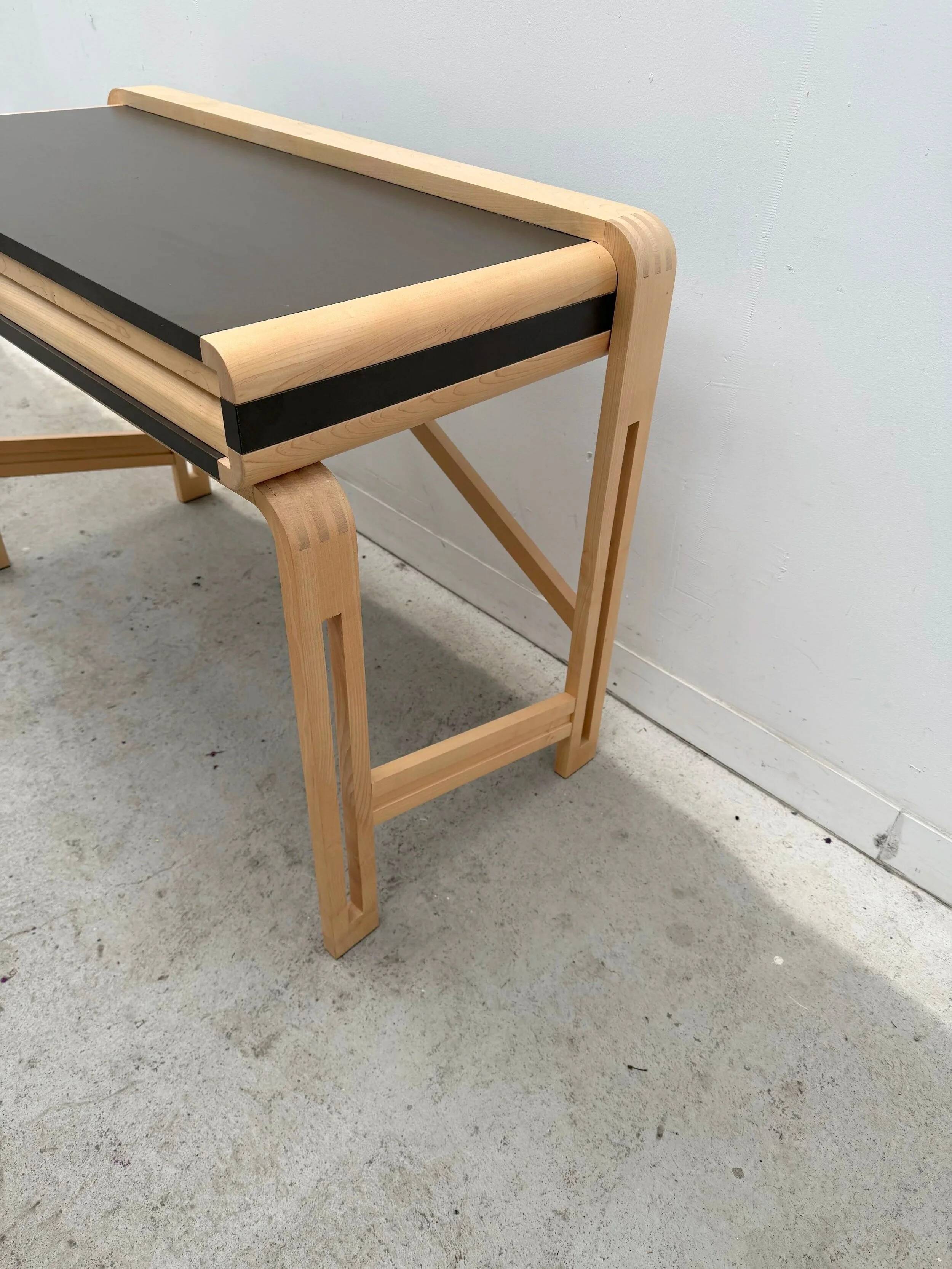 Solid wood and formica desk made by a cabinetmaker.