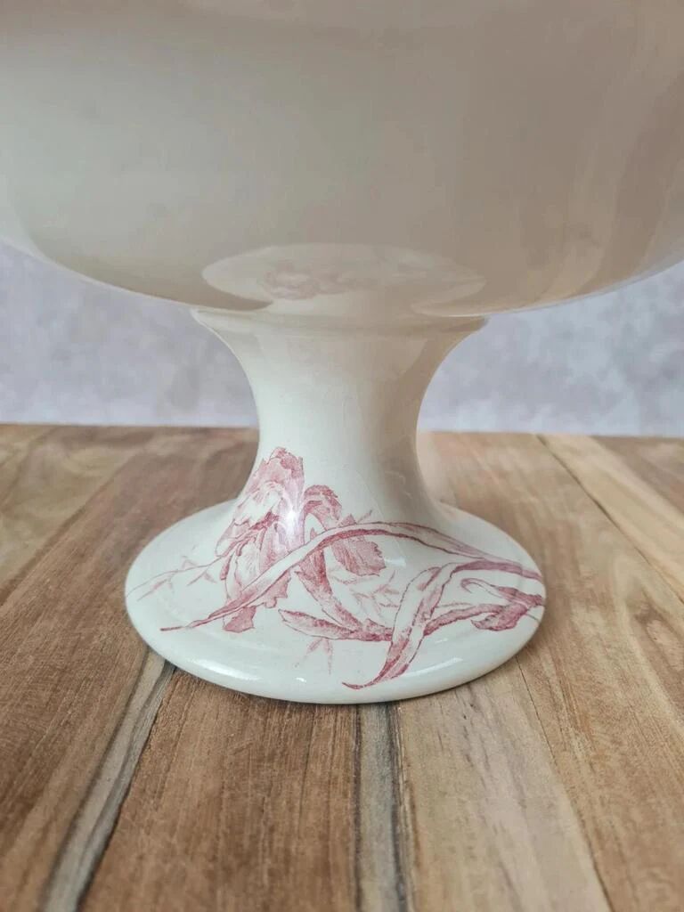 Large footed compote Gien model Iris with red floral decoration.