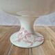 Large footed compote Gien model Iris with red floral decoration.