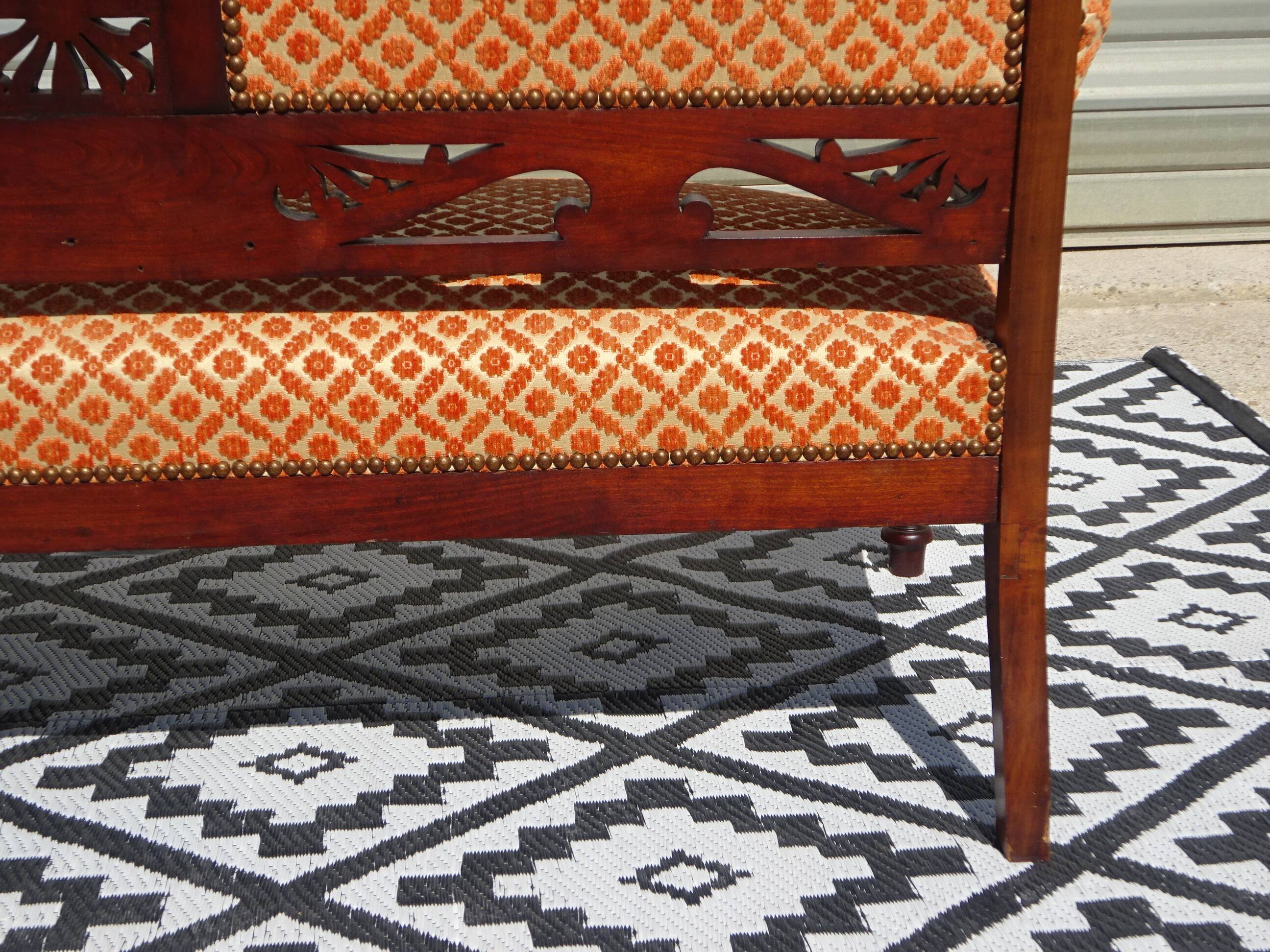 Vintage bench in wood and orange/ivory velvet.