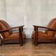 PAIR OF BRUTALIST ARMCHAIRS IN TEAK AND VINTAGE COGNAC LEATHER FROM THE 1950S