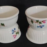 Pair of porcelain diabolo egg cups decorated with 20th century barbels