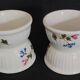 Pair of porcelain diabolo egg cups decorated with 20th century barbels