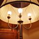 Brass lamppost with pleated lampshades