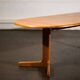 Oval dining table with 2 extensions.