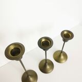 Trio of brass candlesticks
