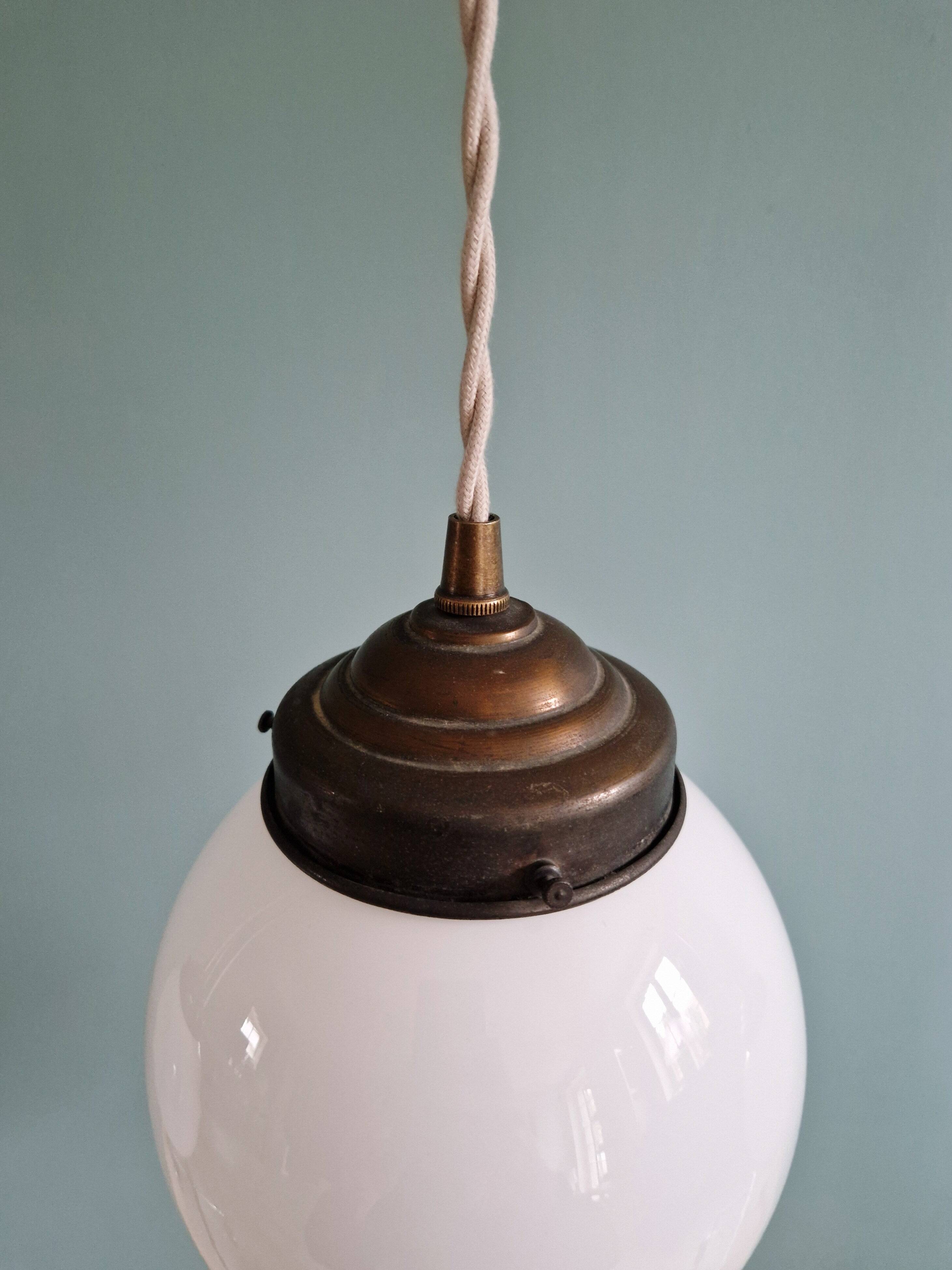 Art Deco trio of suspensions in white opaline, 1930s