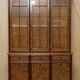Vintage walnut burr buffet with glass and lighting, Art Deco style.