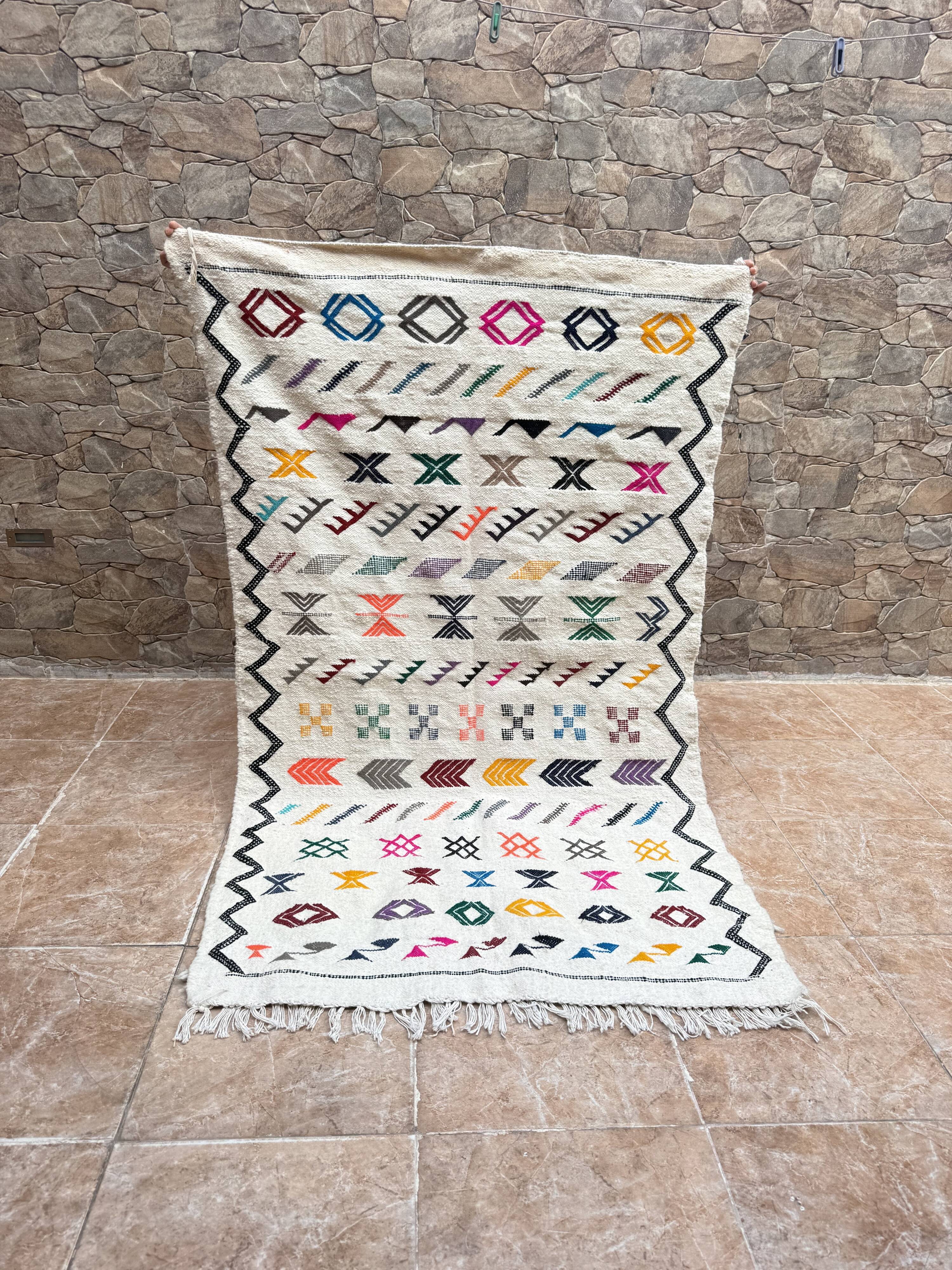 Handwoven Berber kilim rug: small Moroccan decorative rug.