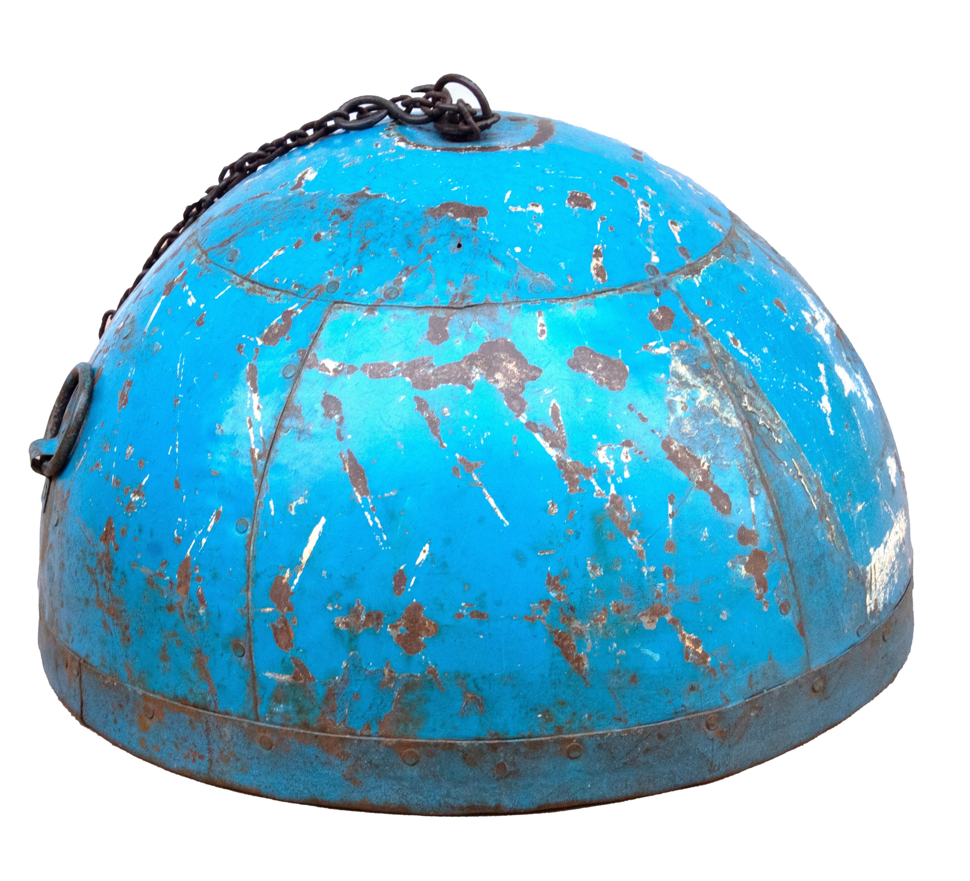 Metal hanging with its original blue colour