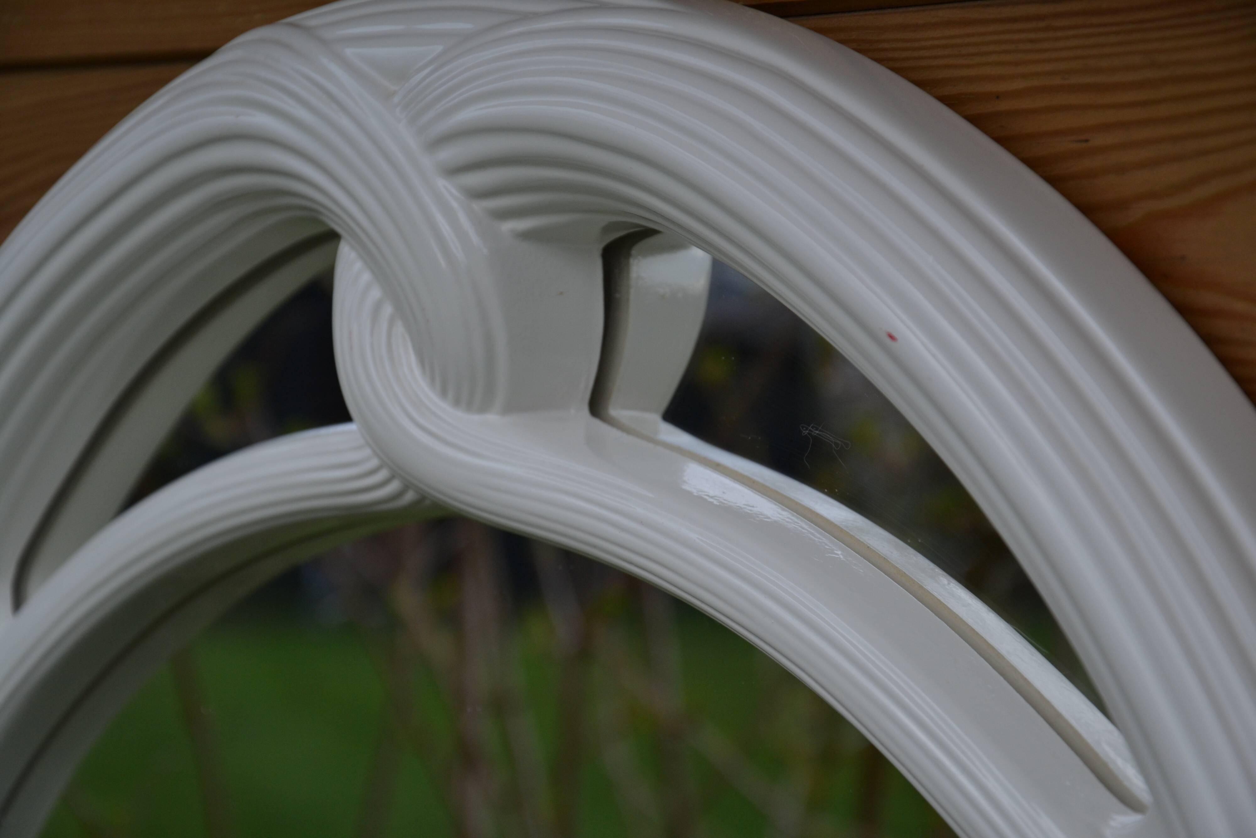 White mirror in 90s Art Deco style