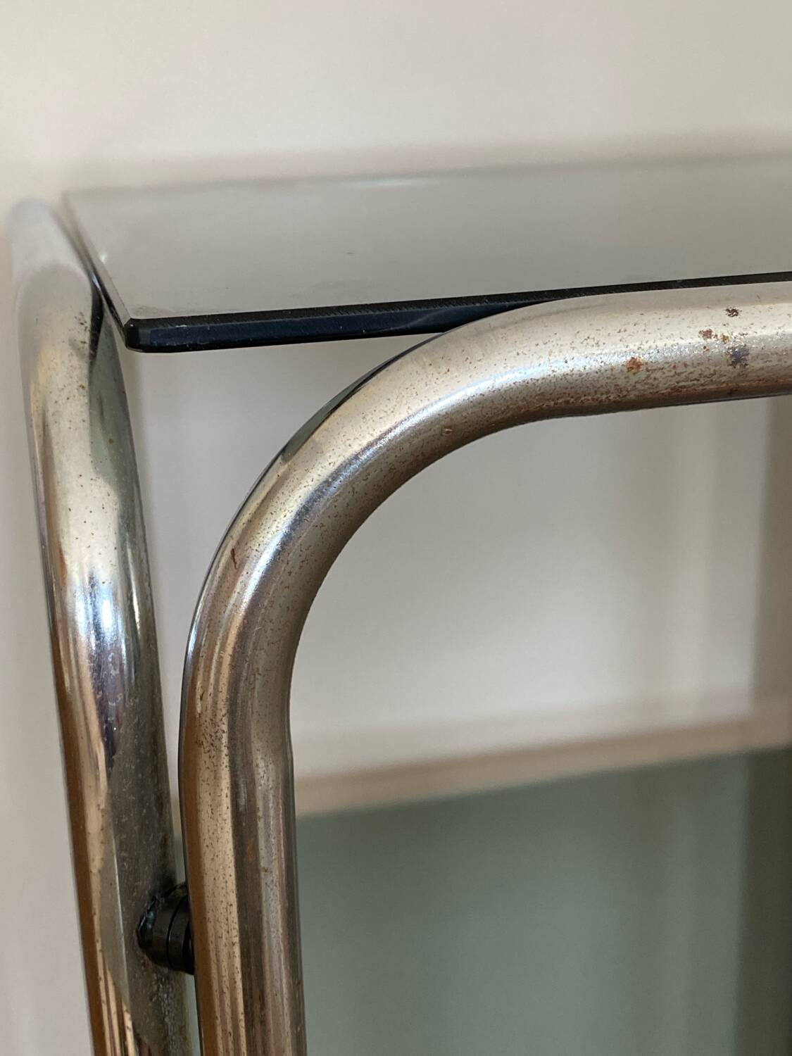 Chrome and smoked glass side table