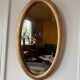 Miroir doré ovale ancien glace biseautée