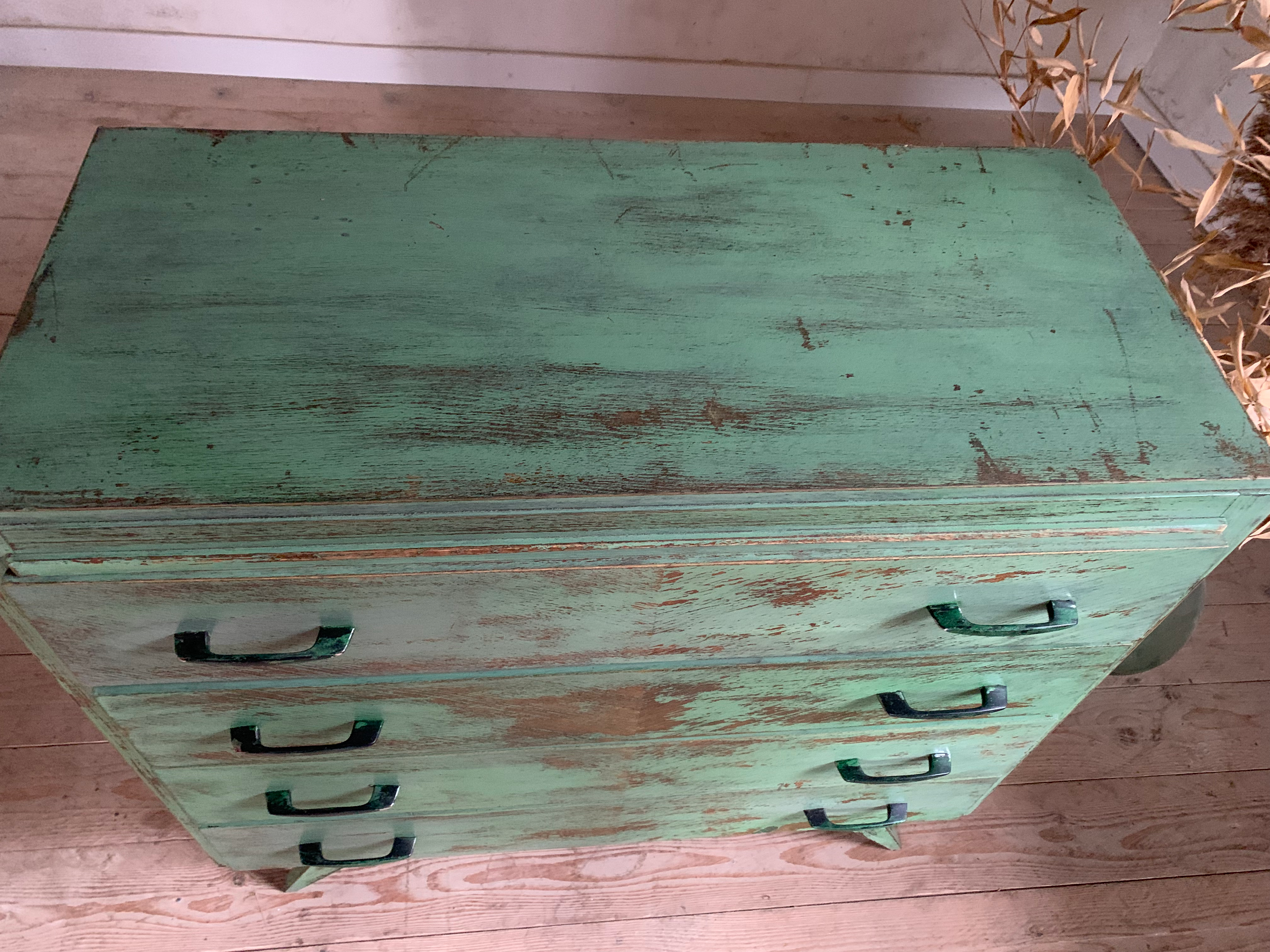 Vintage compass leg commode with a patina.
