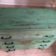 Vintage compass leg commode with a patina.